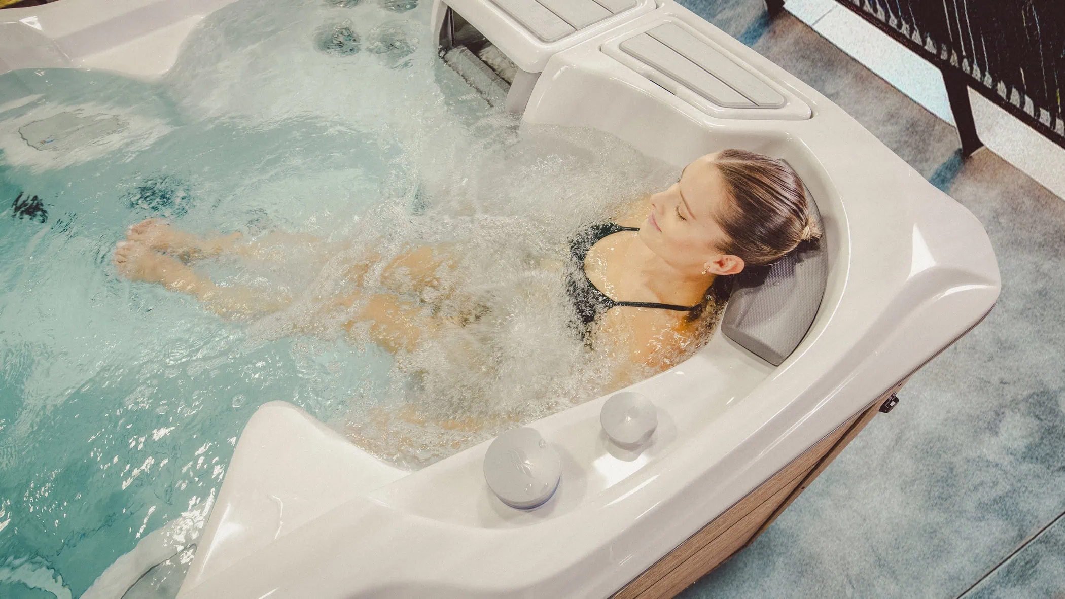 Woman Relaxing In Sundance Swim Spa - Sundance Spas Of Edmonton